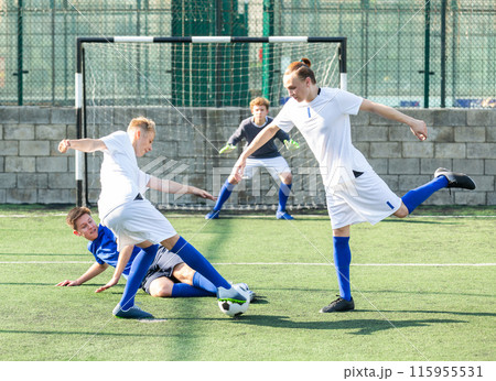Junior football teams having scrimmage 115955531