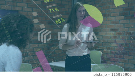 Image of statistical data processing over caucasian woman discussing with colleagues at office Image of statistical data processing over caucasian woman discussing with colleagues at office 115955900