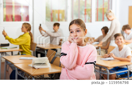 Girl feeling upset after getting bad mark at school Girl feeling upset after getting bad mark at school 115956798