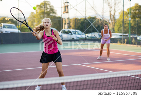 Portrait of emotional woman tennis player during friendly doubles couple match Portrait of emotional woman tennis player during friendly doubles couple match 115957309