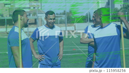 Group of biracial athletes laughing on soccer field 115958256