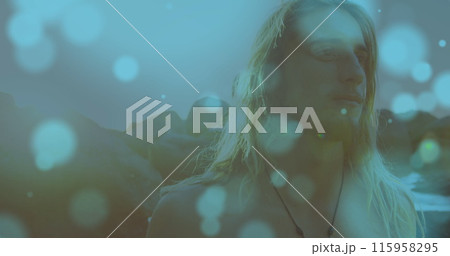 Caucasian young adult with long blonde hair standing outdoors 115958295