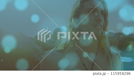 Caucasian young adult standing with thoughtful look, light reflecting around 115958296