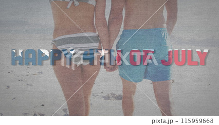 Couple holding hands on a beach 115959668