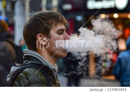 Man smoking cigarette 115962043