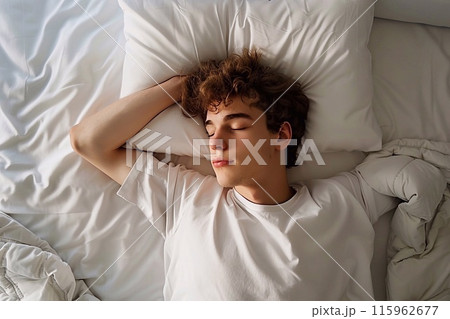 Man sleeping in bed 115962677