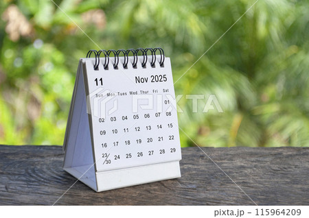 November 2025 white table calendar with outdoor background. Calendar concept November 2025 white table calendar with outdoor background. Calendar concept 115964209