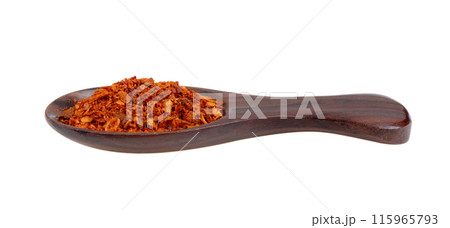 pile of red pepper in wood spoon on white background pile of red pepper in wood spoon on white background 115965793
