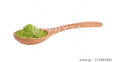 matcha green tea powder in wood spoon on white background 115965882