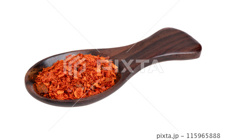 pile of red pepper in wood spoon on white background pile of red pepper in wood spoon on white background 115965888