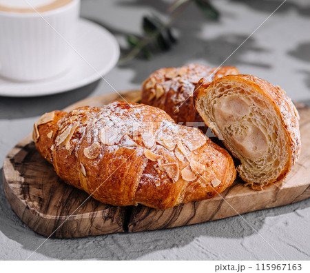Gourmet almond croissants and coffee Gourmet almond croissants and coffee 115967163