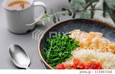 Fresh poke bowl with tea on grey background Fresh poke bowl with tea on grey background 115967208