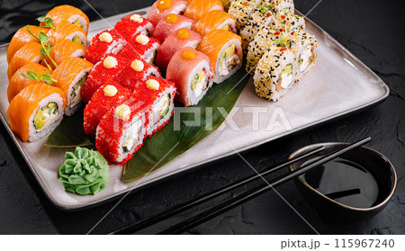 Assortment of fresh sushi rolls on elegant plate 115967240