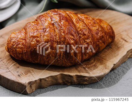 close up Fresh croissant on rustic table 115967245