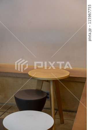 Seating inside the cafe or restaurant, with wooden chairs and table Seating inside the cafe or restaurant, with wooden chairs and table 115967755