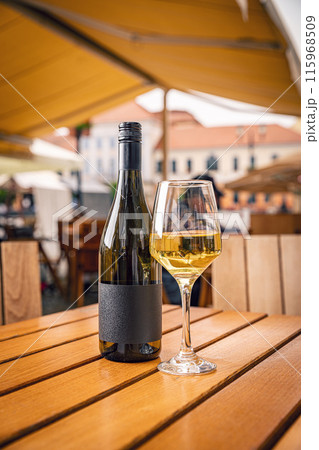 Bottle of white wine and glass 115968509