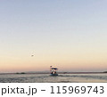 fisherman boat at sunset 115969743