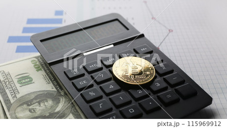 The bitcoin lies on the keyboard of the black 115969912