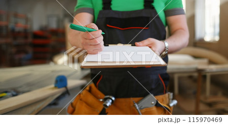 Arms of worker offer clipboard with green pen Arms of worker offer clipboard with green pen 115970469