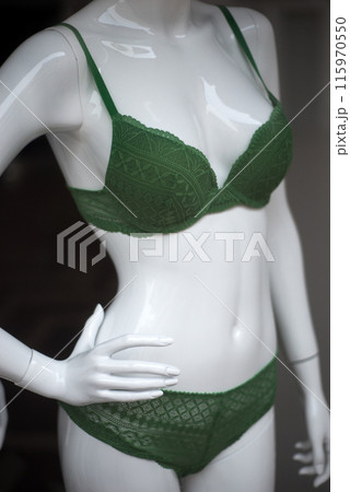 Closeup of green underwear on mannequin in a fashion store showroom 115970550