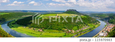 Panoramic scenic wide view of Elbe river curve at Sächsische Schweiz National Park Germany from Königstein fortress castle blue cloudy sky background. Europe travel nature landscape destination 115970983