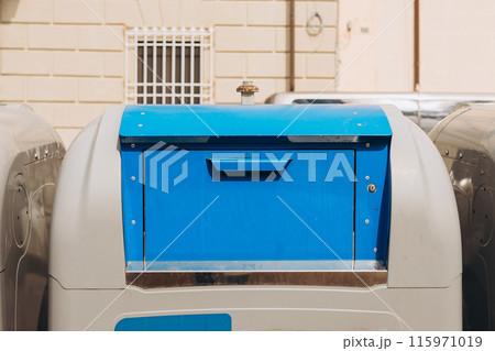 Blue Trash Bin to Recycling Paper. Paper Waste. Eco Lifestyle. Blue Trash Bin to Recycling Paper. Paper Waste. Eco Lifestyle. 115971019