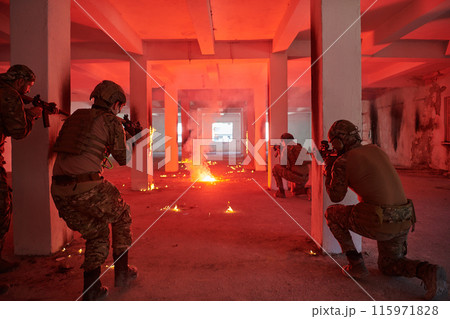 A group of professional soldiers bravely executes a dangerous rescue mission, surrounded by fire in a perilous building. A group of professional soldiers bravely executes a dangerous rescue mission, surrounded by fire in a perilous building. 115971828