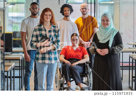 A diverse group of young business people congregates within a modern startup's glass-enclosed office, featuring inclusivity with a person in a wheelchair, an African American young man , and a hijab 115971935