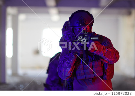 A group of professional soldiers bravely executes a dangerous rescue mission, surrounded by fire in a perilous building. 115972028