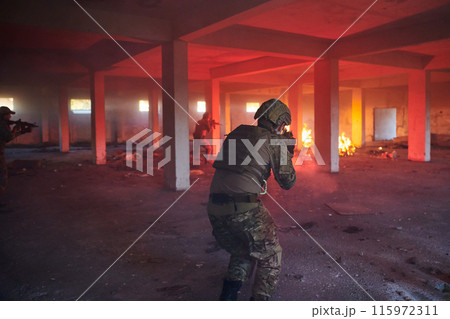 A group of professional soldiers bravely executes a dangerous rescue mission, surrounded by fire in a perilous building. A group of professional soldiers bravely executes a dangerous rescue mission, surrounded by fire in a perilous building. 115972311