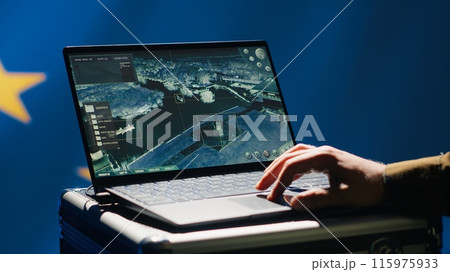 European Union using radar system on laptop to detect incoming ballistic missiles attacking member states. EU alliance army soldier scanning rockets approaching countries, deploying shields, camera A 115975933