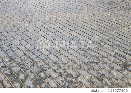 The area is paved with many small stones 115977866