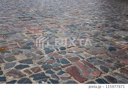 Abstract background of old cobblestone pavement close-up. Abstract background of old cobblestone pavement close-up. 115977871
