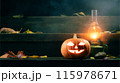 Halloween Pumpkin Jack-O-Lantern and a kerosene lamp on the porch of a house protects against evil spirits 115978671