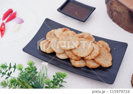 french fries in round slices as a background 115979728