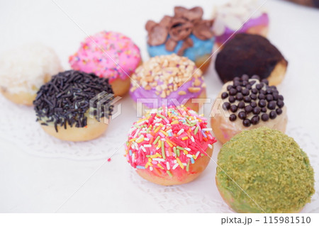 ball donuts with various flavors as a background ball donuts with various flavors as a background 115981510
