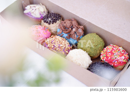 ball donuts with various flavors as a background 115981600