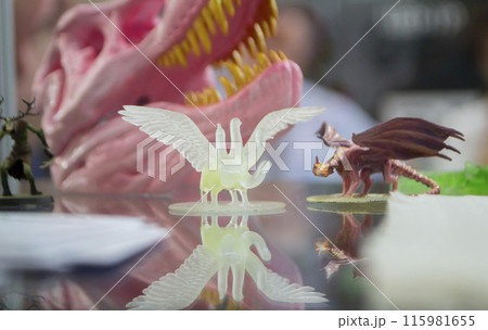 Detailed models in the form of birds printed on 3D printer from polymer close-up. Detailed object created by 3D printer using the 3D printing method. Concept 3D Printing. SLA printing technology 115981655