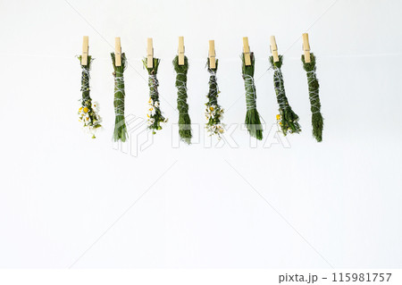 Handmade smudge sticks hanging from rope to dry. 115981757