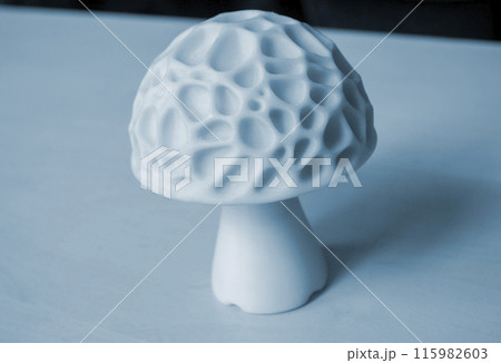 Object in the form of mushroom of white color printed on a 3D printer. Three-dimensional model printed on a 3D printer from molten plastic of red color. Concept 3D Printing. FDM 3D Printing technology 115982603