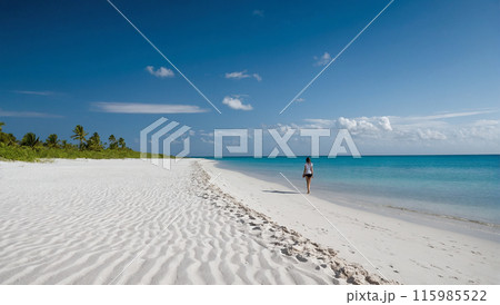 Happy girl walking on a beautiful sandy beach near the ocean 115985522