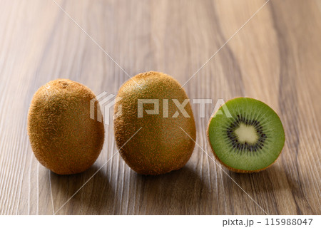 Fresh green kiwi fruit on wooden background, Healthy fruit Fresh green kiwi fruit on wooden background, Healthy fruit 115988047