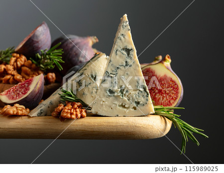 Blue cheese with figs, walnuts, and rosemary. Blue cheese with figs, walnuts, and rosemary. 115989025