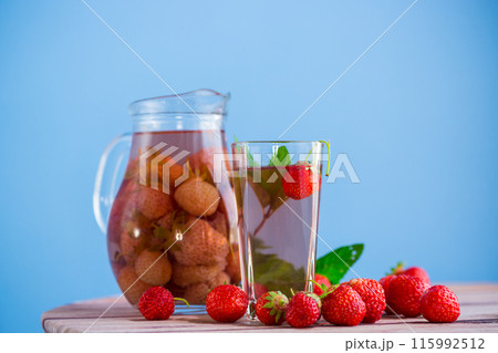 Sweet refreshing berry compote of ripe strawberries in a decanter Sweet refreshing berry compote of ripe strawberries in a decanter 115992512