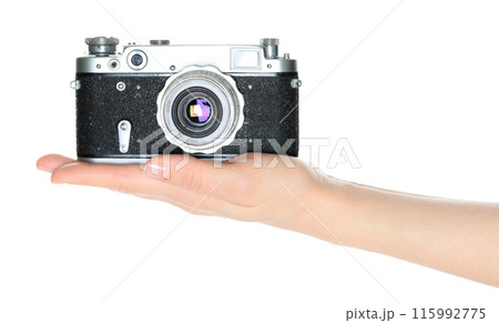 Women hand holding retro photo camera, isolated on white background, front view 115992775