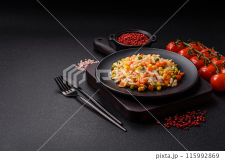 Delicious boiled rice with vegetables corn, carrots, peas with salt 115992869