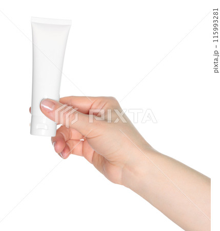 Woman hand holds a white cosmetic cream tube, on white background close-up, template for cosmetics 115993281