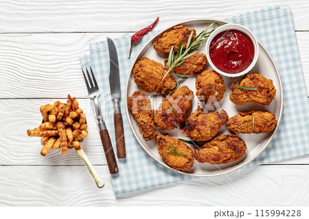 american style fried chicken wings on a plate american style fried chicken wings on a plate 115994228