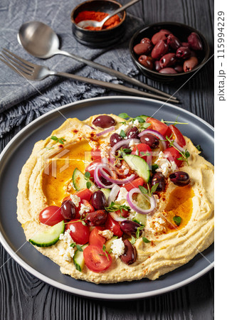 Greek hummus with veggies, olives, feta on plate 115994229