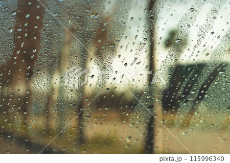 Water drops on vehicle window on rainy day Water drops on vehicle window on rainy day 115996340